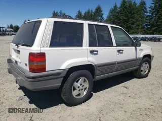 1994 Jeep Grand Cherokee Laredo with VIN 1J4GZ58Y7RC113333, listed as a Copart auction lot 57995734 with 220,950 mi miles and Clean Title. Bid and sale history available at carsss.com. Image 3.