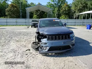2021 Jeep Grand Cherokee High Altitude with VIN 1C4RJECG8MC737932, listed as a Copart auction lot 58368885 with 61,863 mi miles and Salvage title. Bid and sale history available at DreamBid. Image 14.