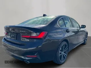 2021 BMW 3 Series 330i with VIN 3MW5R1J04MBB48483, listed as a Copart auction lot 50515195 with 128,555 mi miles and Clean Title. Bid and sale history available at carsss.com. Image 4.