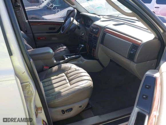 2004 Jeep Grand Cherokee Limited with VIN 1J8GW58N74C380204, listed as a IAAI auction lot 41756657 with 239,697 mi miles. Bid and sale history available at carsss.com. Image 5.