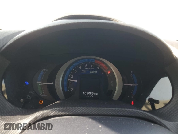 2010 Honda Insight EX z VIN JHMZE2H77AS035113, wystawiony jako Copart lot #54179005 z przebiegiem 165 083 mil mil oraz Szkoda całkowita • Salvage title. Historia ofert i sprzedaży dostępna na DreamBid. Obrazek 9.