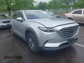 2020 Mazda CX-9 Touring z VIN JM3TCBCY8L0400787, wystawiony jako IAAI lot #42188981 z przebiegiem 86 459 mil mil oraz . Historia ofert i sprzedaży dostępna na DreamBid. Obrazek 1.