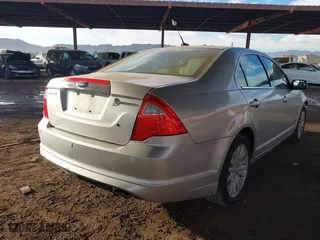 2011 Ford Fusion Hybrid with VIN 3FADP0L35BR256789, listed as a IAAI auction lot 40737584 with 133,683 mi miles. Bid and sale history available at carsss.com. Image 4.