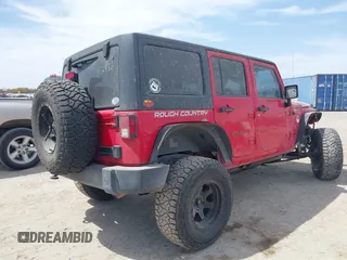 2015 Jeep Wrangler Unlimited Willys Wheeler with VIN 1C4BJWDG9FL750505, listed as a IAAI auction lot 41781762 with 139,000 mi miles and . Bid and sale history available at DreamBid. Image 4.