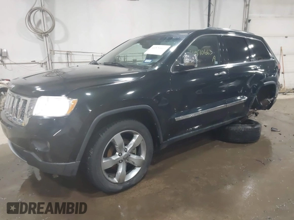 2013 Jeep Grand Cherokee Overland with VIN 1C4RJECT4DC526465, listed as a IAAI auction lot 41570663 with 116,948 mi miles. Bid and sale history available at carsss.com. Image 17.