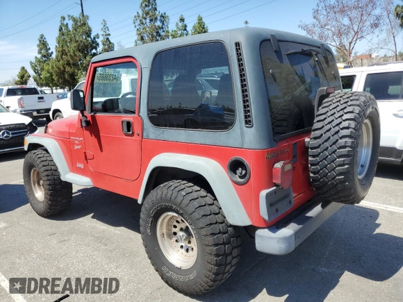 1999 Jeep Wrangler Sport with VIN 1J4FY19S7XP401120, listed as a Copart auction lot 64233665 with 129,708 mi miles and Salvage title. Bid and sale history available at DreamBid. Image 2.