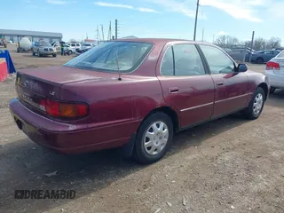 1996 Toyota Camry DX with VIN 4T1BG12K1TU785209, listed as a IAAI auction lot 41802026 with 223,452 mi miles. Bid and sale history available at carsss.com. Image 4.