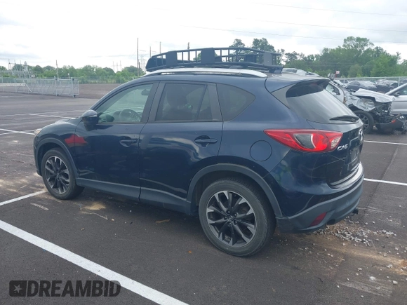 2016 Mazda CX-5 Grand Touring with VIN JM3KE2DYXG0890174, listed as a IAAI auction lot 42157884 with 141,873 mi miles. Bid and sale history available at carsss.com. Image 14.