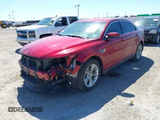 2013 Ford Taurus SEL with VIN 1FAHP2E8XDG231807, listed as a IAAI auction lot 41774166 with 120,639 mi miles and . Bid and sale history available at carsss.com. Image 2.