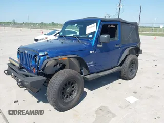 2010 Jeep Wrangler Sport with VIN 1J4AA2D11AL117404, listed as a IAAI auction lot 42012340 with 266,310 mi miles and . Bid and sale history available at carsss.com. Image 17.