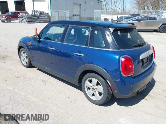 2015 MINI Hardtop 4 Door z VIN WMWXS5C58FT829805, wystawiony jako IAAI lot #42023026 z przebiegiem 141 330 mil mil oraz . Historia ofert i sprzedaży dostępna na DreamBid. Obrazek 3.