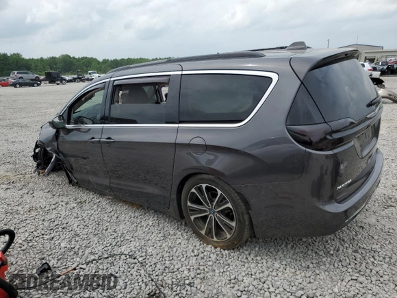2021 Chrysler Pacifica Touring with VIN 2C4RC1FGXMR550164, listed as a Copart auction lot 57297585 with 10,222 mi miles and Salvage title. Bid and sale history available at DreamBid. Image 2.
