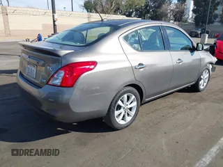 2014 Nissan Versa S with VIN 3N1CN7APXEL817010, listed as a IAAI auction lot 41460129 with 137,040 mi miles. Bid and sale history available at carsss.com. Image 4.