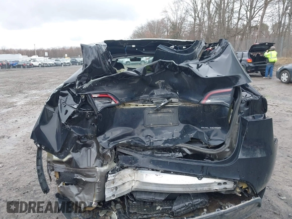 2022 Tesla Model Y Long Range with VIN 7SAYGDEE5NA016892, listed as a IAAI auction lot 41936735 with 69,136 mi miles and . Bid and sale history available at DreamBid. Image 16.