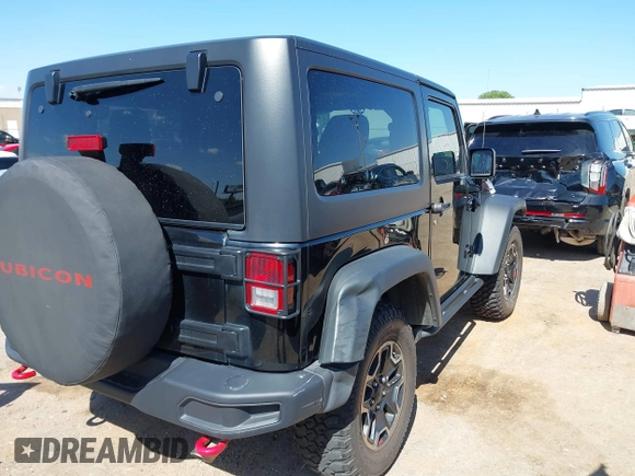 2015 Jeep Wrangler Rubicon Hard Rock with VIN 1C4BJWCG1FL610028, listed as a IAAI auction lot 42318569 with 48,627 mi miles and . Bid and sale history available at DreamBid. Image 6.