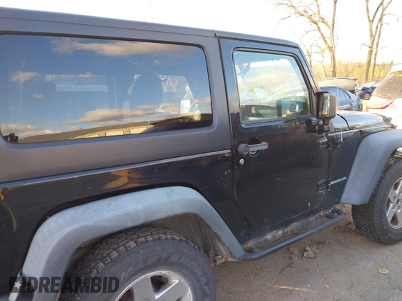 2011 Jeep Wrangler Rubicon with VIN 1J4HA6D11BL564211, listed as a IAAI auction lot 41242240 with 124,039 mi miles and . Bid and sale history available at carsss.com. Image 13.