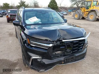 2024 Honda Pilot Touring with VIN 5FNYG1H72RB007519, listed as a IAAI auction lot 40973780 with 24,908 mi miles. Bid and sale history available at carsss.com. Image 6.