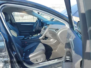 2014 Ford Fusion Titanium with VIN 3FA6P0K90ER336116, listed as a IAAI auction lot 41559792 with 132,852 mi miles. Bid and sale history available at carsss.com. Image 5.
