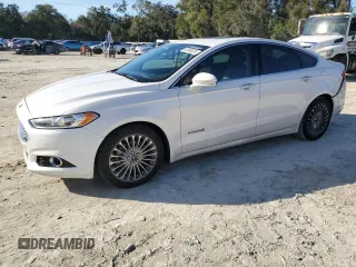 2013 Ford Fusion Titanium Hybrid with VIN 3FA6P0RU2DR277773, listed as a Copart auction lot 85990424 with 215,289 mi miles and Non Repairable. Bid and sale history available at DreamBid. Image 1.