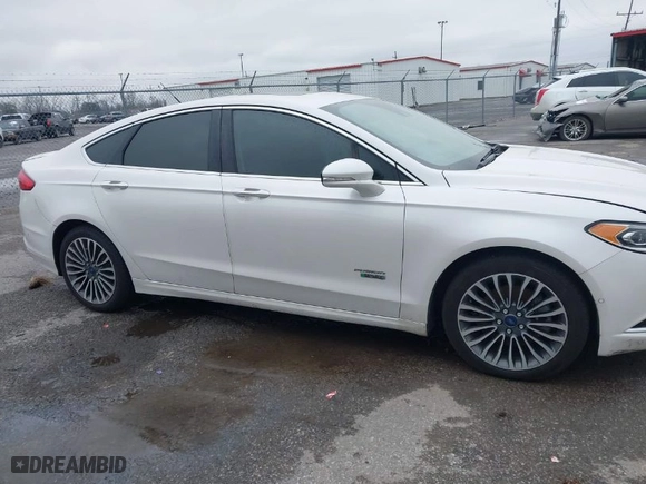 2017 Ford Fusion Energi Titanium with VIN 3FA6P0SU7HR191665, listed as a IAAI auction lot 41597438 with 166,570 mi miles. Bid and sale history available at carsss.com. Image 13.
