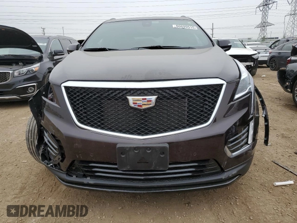 2021 Cadillac XT5 AWD Sport with VIN 1GYKNGRS2MZ142286, listed as a Copart auction lot 60699515 with 17,406 mi miles and Salvage title. Bid and sale history available at DreamBid. Image 5.