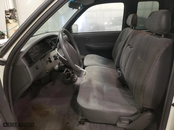 1996 Toyota T100 DX with VIN JT4TN12D8T0027875, listed as a Copart auction lot 85077784 with 123,421 mi miles and Salvage Title. Bid and sale history available at carsss.com. Image 7.
