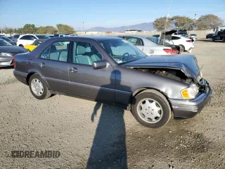 1997 Mercedes-Benz C with VIN WDBHA23E7VF545229, listed as a Copart auction lot 43518335 with 153,158 mi miles and Salvage title. Bid and sale history available at DreamBid. Image 4.