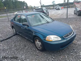 1997 Honda Civic LX with VIN 2HGEJ6674VH584711, listed as a IAAI auction lot 41848808 with 210,295 mi miles. Bid and sale history available at carsss.com. Image 1.