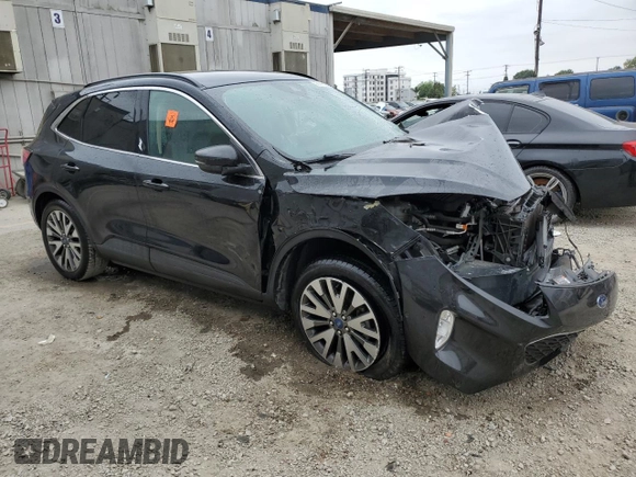 2020 Ford Escape Titanium with VIN 1FMCU9J97LUA59056, listed as a Copart auction lot 58445885 with Not provided miles and Salvage title. Bid and sale history available at DreamBid. Image 4.