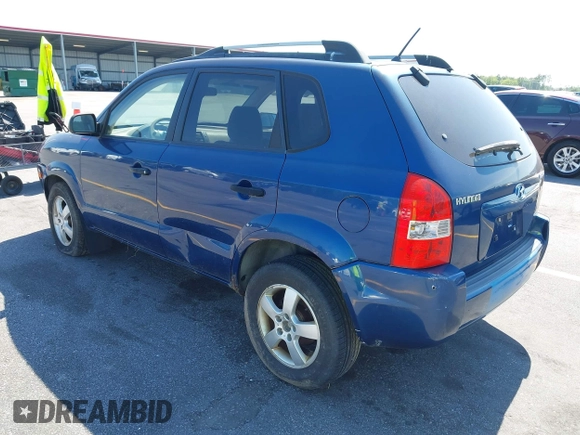 2005 Hyundai Tucson GL with VIN KM8JM12B85U233228, listed as a IAAI auction lot 42051627 with 170,742 mi miles. Bid and sale history available at carsss.com. Image 3.