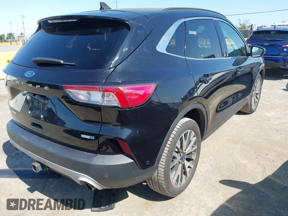 2020 Ford Escape Titanium z VIN 1FMCU9J97LUB18350, wystawiony jako IAAI lot #42574736 z przebiegiem 82 551 mil mil oraz . Historia ofert i sprzedaży dostępna na DreamBid. Obrazek 4.