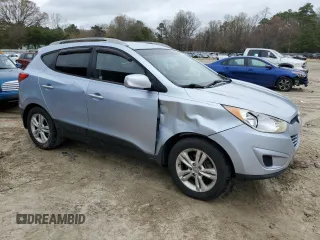 2011 Hyundai Tucson Limited with VIN KM8JUCAC8BU196358, listed as a Copart auction lot 51111975 with 200,439 mi miles and Salvage Title. Bid and sale history available at DreamBid. Image 4.