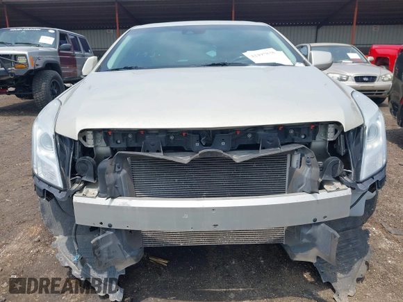2014 Cadillac XTS Luxury z VIN 2G61M5S38E9291182, wystawiony jako IAAI lot #42495838 z przebiegiem 104 941 mil mil oraz . Historia ofert i sprzedaży dostępna na DreamBid. Obrazek 6.