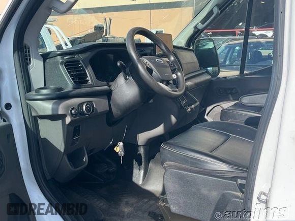 2021 Ford Transit Cargo with VIN 1FTYE1C82MKA94596, listed as a IAAI auction lot 42821368 with 91,455 mi miles and . Bid and sale history available at DreamBid. Image 12.