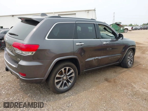 2017 Jeep Grand Cherokee Overland with VIN 1C4RJFCG6HC964435, listed as a IAAI auction lot 42407567 with 113,760 mi miles and . Bid and sale history available at DreamBid. Image 4.