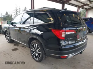 2021 Honda Pilot Elite with VIN 5FNYF6H04MB043014, listed as a IAAI auction lot 41826931 with 63,546 mi miles and . Bid and sale history available at DreamBid. Image 3.