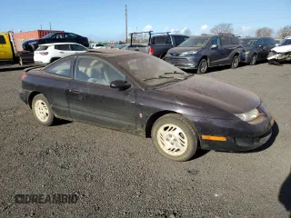 1999 Saturn SC with VIN 1G8ZR1274XZ262181, listed as a Copart auction lot 75931774 with Not Provided miles and Salvage Title. Bid and sale history available at carsss.com. Image 4.
