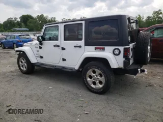 2013 Jeep Wrangler Unlimited Sahara with VIN 1C4HJWEG9DL628684, listed as a Copart auction lot 57672175 with 69,010 mi miles and Salvage title. Bid and sale history available at DreamBid. Image 2.