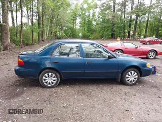 2000 Chevrolet Prizm LSi z VIN 1Y1SK5289YZ401584, wystawiony jako IAAI lot #42263210 z przebiegiem 151 567 mil mil oraz . Historia ofert i sprzedaży dostępna na DreamBid. Obrazek 13.