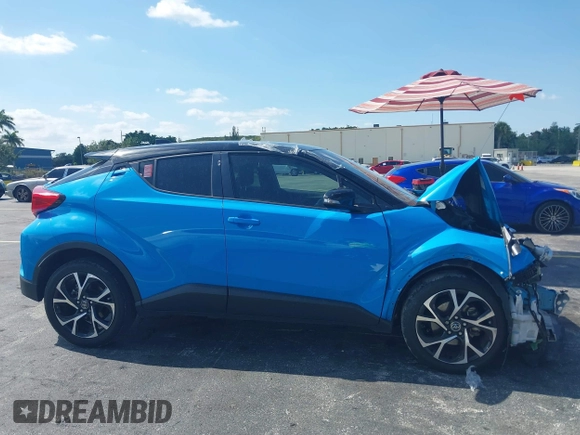 2019 Toyota C-HR XLE with VIN NMTKHMBX6KR097934, listed as a IAAI auction lot 39276687 with 56,973 mi miles. Bid and sale history available at carsss.com. Image 12.