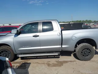 2011 Toyota Tundra with VIN 5TFRM5F18BX033833, listed as a IAAI auction lot 42257200 with 108,046 mi miles and . Bid and sale history available at DreamBid. Image 14.