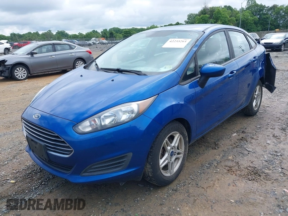 2018 Ford Fiesta SE z VIN 3FADP4BJXJM126168, wystawiony jako IAAI lot #42255261 z przebiegiem 121 248 mil mil oraz . Historia ofert i sprzedaży dostępna na DreamBid. Obrazek 2.