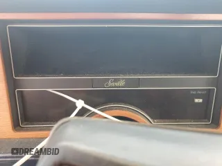 1987 Cadillac Seville z VIN 1G6KS518XHU812739, wystawiony jako Copart lot #79308574 z przebiegiem Nie podano mil oraz Szkoda całkowita • Salvage title. Historia ofert i sprzedaży dostępna na DreamBid. Obrazek 9.