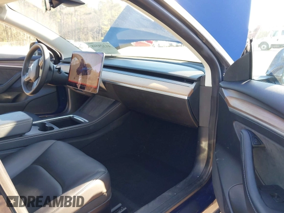 2022 Tesla Model 3 Long Range with VIN 5YJ3E1EB1NF257059, listed as a IAAI auction lot 41329318 with 30,652 mi miles and . Bid and sale history available at DreamBid. Image 5.