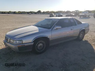 2000 Cadillac Eldorado Touring with VIN 1G6ET1295YU145248, listed as a Copart auction lot 82160574 with 87,294 mi miles and Salvage Title. Bid and sale history available at DreamBid. Image 1.