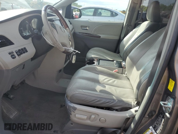 2011 Toyota Sienna XLE AAS with VIN 5TDYK3DC5BS010512, listed as a Copart auction lot 58614775 with 215,020 mi miles and Clean title. Bid and sale history available at DreamBid. Image 7.
