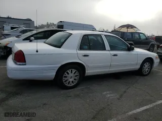 2005 Ford Crown Victoria LX with VIN 2FAFP74W95X124697, listed as a Copart auction lot 86931404 with 303,132 mi miles and Clean Title. Bid and sale history available at carsss.com. Image 3.