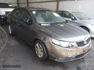 2010 Kia Forte EX with VIN KNAFU4A26A5882153, listed as a IAAI auction lot 41904559 with 162,554 mi miles. Bid and sale history available at carsss.com. Image 1.