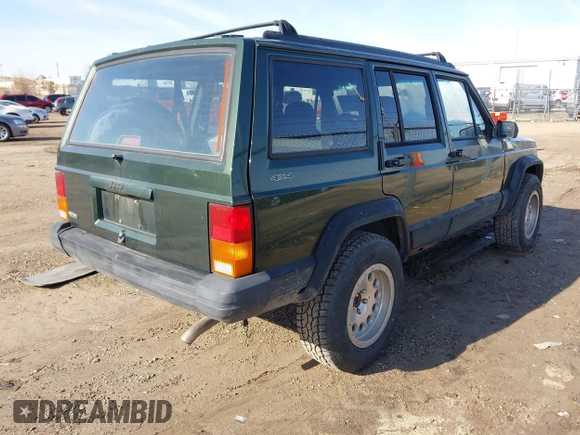 1996 Jeep Cherokee Sport with VIN 1J4FJ68S2TL299150, listed as a IAAI auction lot 41932867 with 142,761 mi miles. Bid and sale history available at carsss.com. Image 4.