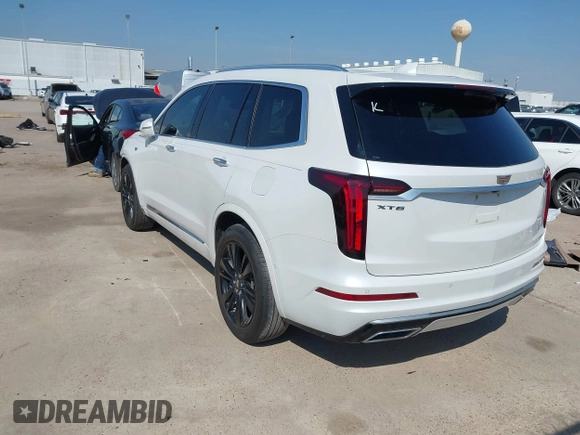 2020 Cadillac XT6 FWD Premium Luxury z VIN 1GYKPERS1LZ103976, wystawiony jako IAAI lot #41679005 z przebiegiem 57 249 mil mil oraz . Historia ofert i sprzedaży dostępna na DreamBid. Obrazek 3.